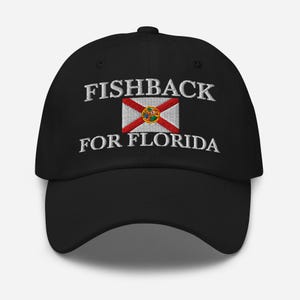 May include: Black baseball cap with the text "FISHBACK FOR FLORIDA" embroidered in white. The Florida state flag is embroidered in the center. The cap has a curved brim and an adjustable strap.