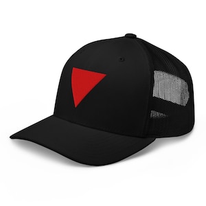 May include: Black trucker cap featuring a red triangle emblem. The cap has a curved peak and a mesh back for breathability. A fashionable accessory for everyday use.