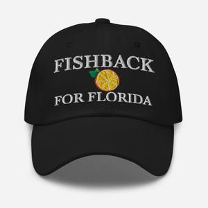 May include: A white ceramic mug with a black handle and the text "But First, Coffee" in a handwritten style. The mug is on a white surface. The mug is approximately 4 inches tall.