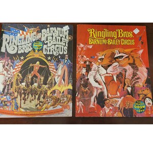 May include: Two vintage Ringling Bros. and Barnum & Bailey Circus programs. The program on the left is a Spectacular Bicentennial Edition with a colorful illustration of a circus performer, horses, and tigers. The program on the right features a tiger's face.