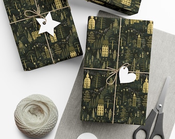May include: Three gift boxes wrapped in dark green wrapping paper with a gold and white pattern of houses and trees. The boxes are tied with twine and decorated with white paper stars and hearts.