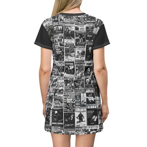 A flat-lay view of the back of a t-shirt dress showing the continuous black-and-white vintage horror poster print and solid black sleeves.