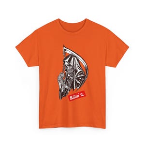 An orange short-sleeve t-shirt featuring a black and white graphic of a grim reaper holding a scythe, with a red rectangular patch below containing the white text Killin it.
