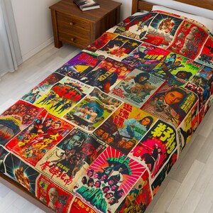 A blanket patterned with a collage of vintage Kung Fu movie posters covers a bed with a wooden headboard.