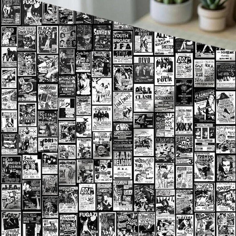 A close-up view of black-and-white punk flyer collage fabric with potted plants in the blurred background.