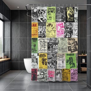 May include: A shower curtain featuring a collage of vintage punk rock concert posters. The posters are in various colors, including yellow, green, and red, with black and white graphics and text. The curtain hangs in a modern bathroom with gray tile.