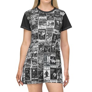 A close-up shot of the front of a t-shirt dress featuring a black-and-white collage of vintage horror film posters and solid black short sleeves.