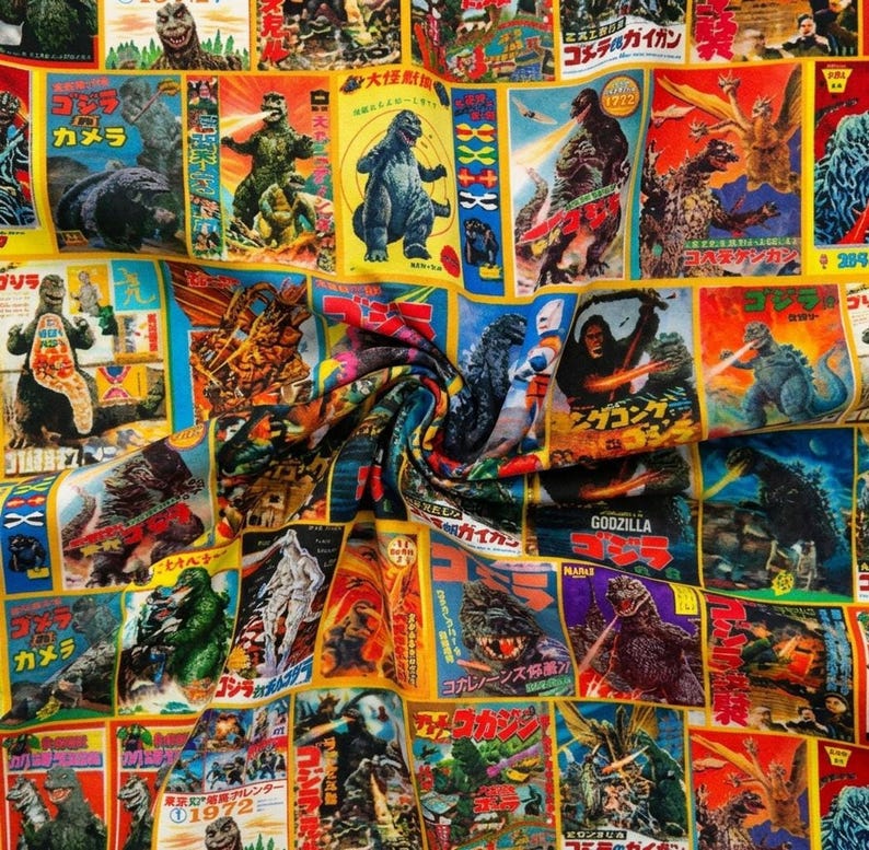 A close-up shot of the colorful vintage Godzilla and kaiju movie poster fabric swirled in the center.