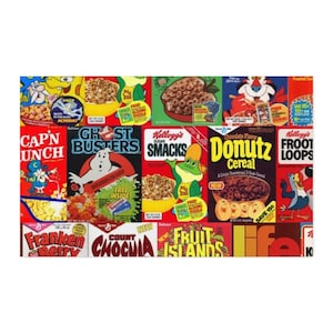 A close-up of a fabric swatch showing a collage of vintage cereal box designs, including Cap'n Crunch, Ghostbusters, and Count Chocula.