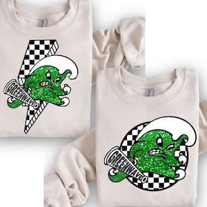 May include: Two cream-colored sweatshirts with a green and white graphic of a cartoon wave with a mouth and a megaphone that says "Greenwave". The wave is on a checkered background.