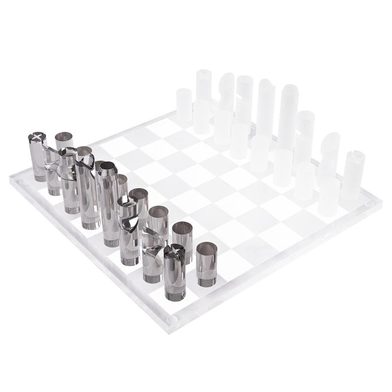 May include: A modern chess set with a clear acrylic board and cylindrical pieces. One side features silver metal pieces, while the opposing side has frosted white pieces. The board has a classic checkered pattern.