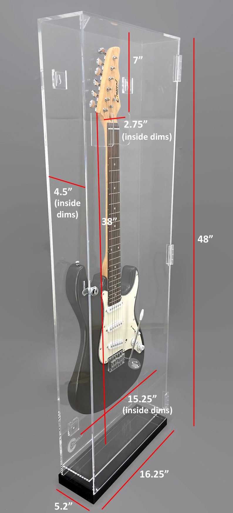 May include: Clear acrylic guitar display case with a black base. The case is 48 inches tall, 16.25 inches wide, and 7 inches deep. Inside dimensions are 4.5 inches deep and 15.25 inches wide. A black electric guitar is inside the case.