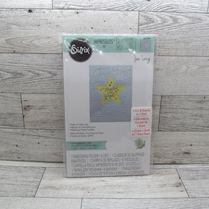 Juego de troqueles y carpeta de relieve Sizzix Impresslits Celestrial