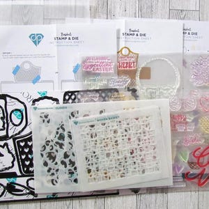 May include: A collection of craft supplies, including stencils, stamps, and dies, for creating Easter-themed projects. The set includes various designs such as hearts, eggs, and the word "Love". The instruction sheets are visible.