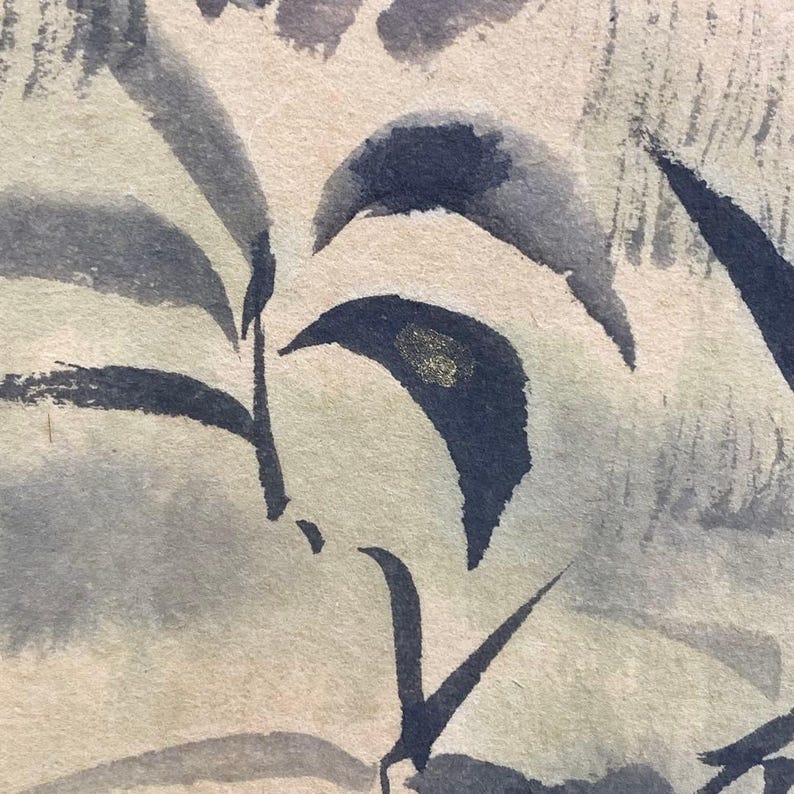 May include: Watercolor painting of stylized leaves in shades of blue and gray. The leaves have a dark blue outline and a gold accent. The background is a light beige color.