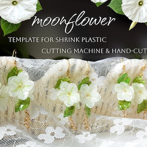 May include: White flower earrings with green leaves and gold-colored wire accents. The earrings are displayed on a white lace background. The text "moonflower" and "TEMPLATE FOR SHRINK PLASTIC CUTTING MACHINE & HAND-CUT" are visible.