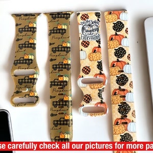May include: Four watch straps with autumnal designs. Two straps display a truck carrying pumpkins on a tan backdrop. The other two straps have pumpkin and polka dot patterns with the text "It's the season for Pumpkin Everything".