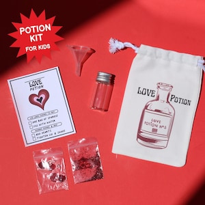 May include: A red background with a potion kit for kids. The kit includes a small glass bottle, a funnel, a drawstring bag with a potion bottle graphic, and a card that says "Love Potion". Also included are two small bags of glitter and heart-shaped confetti.