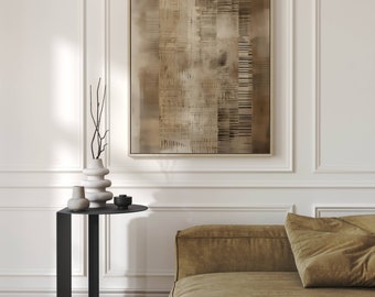 May include: A brown abstract painting in a light wood frame hangs on a white wall above a black side table with a round top. The table has a vase with dried branches and two smaller vases on it. A brown sofa with a large brown pillow is in the foreground.