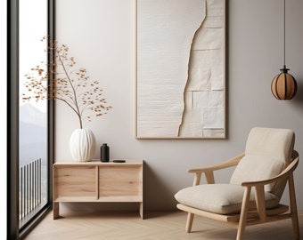 Puede incluir: Una mesa auxiliar de madera clara con dos cajones y un jarrón blanco con ramas secas. Un sillón beige con estructura de madera clara se encuentra frente a una impresión de arte abstracto blanco con marco de madera. Una lámpara colgante marrón cuelga del techo.