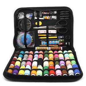 May include: A black zippered sewing kit, open to reveal an assortment of sewing supplies. The kit includes spools of colorful thread, needles, scissors, measuring tape, pins, and other essential tools for sewing and crafting.