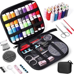 May include: A black sewing kit with a variety of colorful thread spools, needles, scissors, buttons, and a measuring tape. The kit includes a small black zippered pouch and a magnifying glass. The thread colors include red, pink, blue, and yellow.