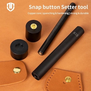 May include: A snap button setter tool set with the text "Snap button Setter tool". The set includes black tools, cylindrical pieces, and leather samples with gold-colored snaps. The tools have the number "633" printed on them.