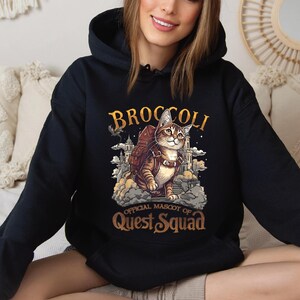 a woman sitting on a couch wearing a hoodie