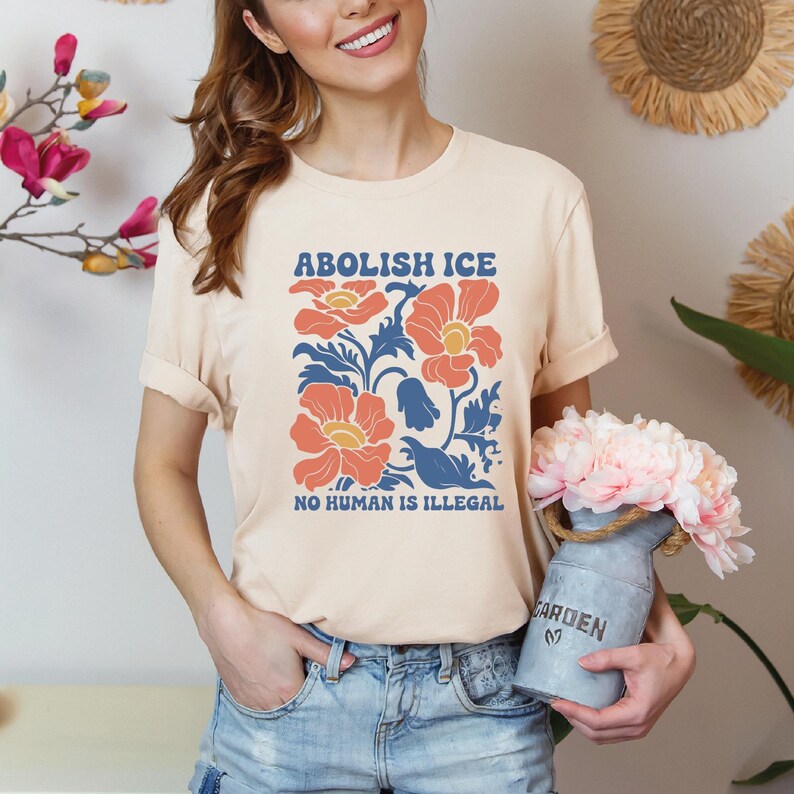 a woman is holding a vase with flowers in it