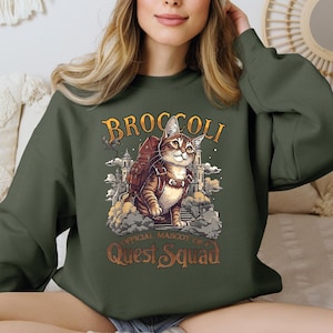 a woman wearing a green sweatshirt with a cat on it