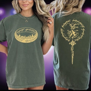A woman wearing a green t-shirt with a graphic design on the front and back.