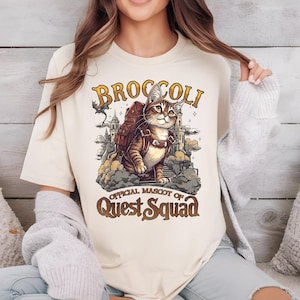 a woman wearing a t - shirt with a cat on it