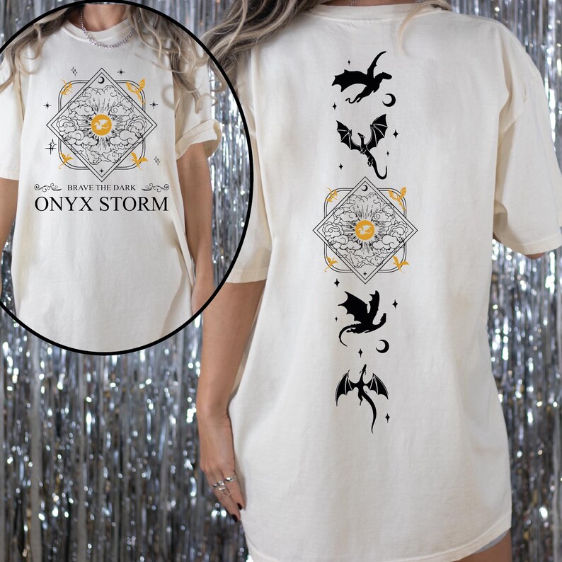 a woman wearing a white t - shirt with a dragon on it