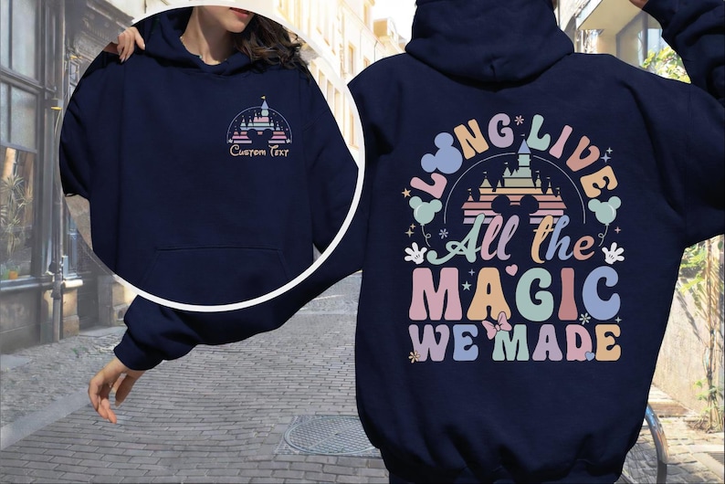 A person wearing a navy blue hoodie with a colorful graphic design on the back.