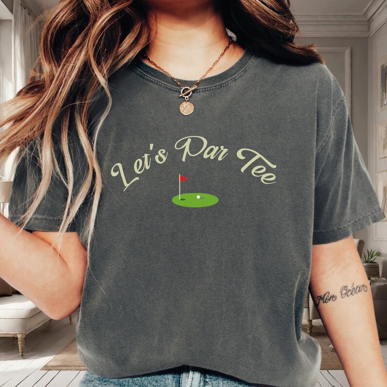 a woman wearing a tee shirt that says let's pan toe