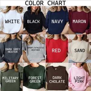 The image is a color chart displaying various color options for tops, including white, black, navy, maroon, dark grey, sport/athletic heater, red, sand, military green, forest green, and light pink.