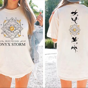 a woman wearing a t - shirt with the words onyx storm printed on it