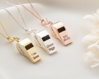 May include: Three gold, silver, and rose gold necklaces with whistle pendants. The whistles are engraved with the words "Drink Some", "Cheers Guys", and "Baby Charlie".