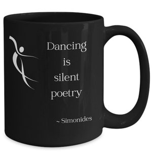 May include: Black ceramic coffee mug with a white silhouette of a dancer and the text "Dancing is silent poetry - Simonides".