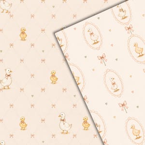 May include: A light cream-colored fabric or paper featuring a repeating pattern of small yellow ducklings wearing pink bows, interspersed with tiny pink bows and small green hearts, with some ducks framed in ornate oval borders.