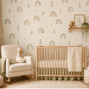 May include: A nursery room featuring wallpaper with a repeating pattern of muted green and tan rainbows, small flowers, and hearts. The room includes a light wood crib with a sage green skirt, a cream-colored rocking chair, and plush duck toys.