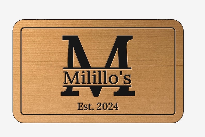 May include: A wooden sign with a black letter "M" and the text "Millillo's Est. 2024".