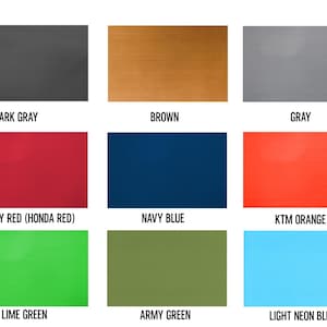 May include: A color palette featuring nine rectangular swatches. The colors include dark gray, brown, gray, ruby red, navy blue, KTM orange, lime green, army green, and light neon blue. Each color is labeled with its name.