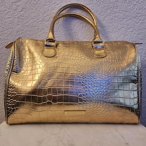 Monedero vintage BCBGMaxazaria con efecto serpiente dorado