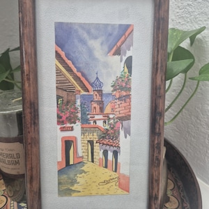 Framed and signed Mexican Watercolor art of a church pueblo scene