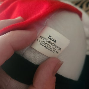 May include: White tag with black text that reads "Kcare KIU HUNG INDUSTRIES LTD. 63 Au Pui Wan St., Fotan, Hong Kong. 14/F., Yale Ind. Centre, Email:kh@kiuhung.com"