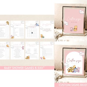 Może przedstawiać: Zestaw gier na baby shower i niestandardowych znak&oacute;w z postaciami Kubusia Puchatka. Gry są wydrukowane na białym papierze z r&oacute;żowymi akcentami i ilustracjami chmur. Znaki mają r&oacute;żowe tło z napisem "Custom sign".