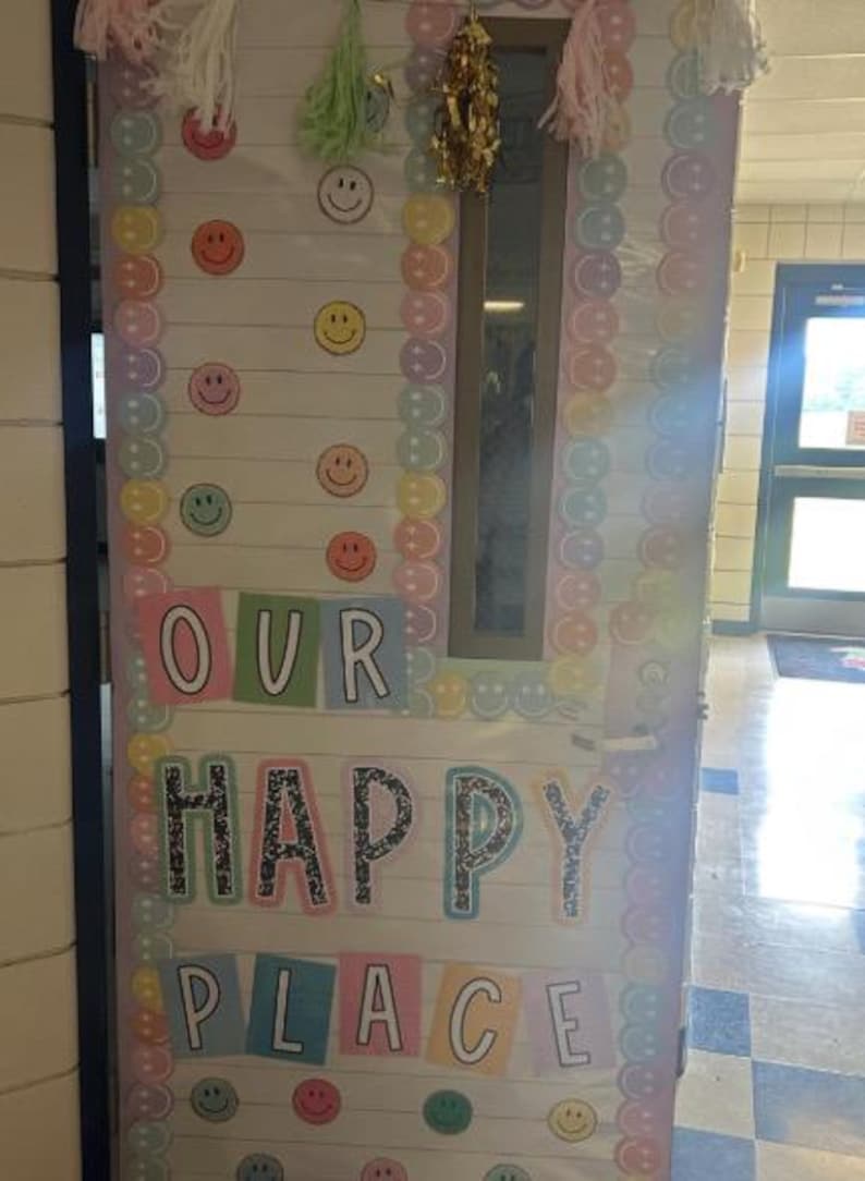 May include: A pastel-colored door decorated with smiley faces and buttons. The door has the words "Our Happy Place" written on it.