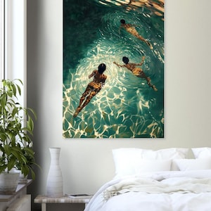 May include: Three people are swimming underwater in a pool. The water is a vibrant teal green with sunlight reflecting off the surface. The swimmers are all facing away from the viewer, with their backs to the camera.