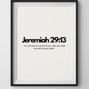 May include: A framed print featuring the text "Jeremiah 29:13" in black. The quote below reads: "You will seek me and find me, when you seek me with all your heart." The print is set within a black frame.